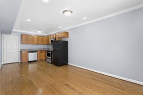 Washington apartment for rent - a kitchen with wood floors and wooden cabinets